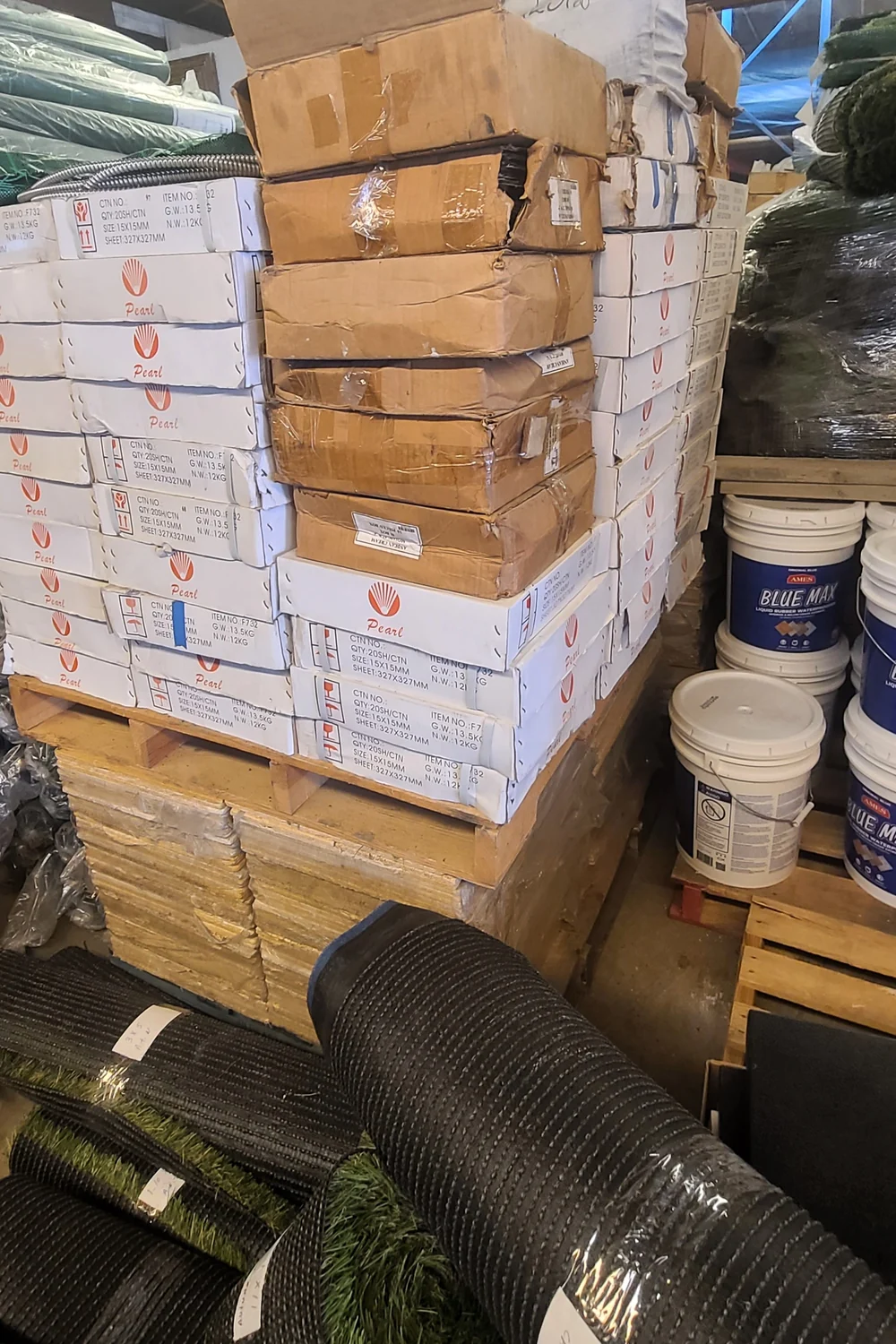 Warehouse supplies alongside artificial turf inventory